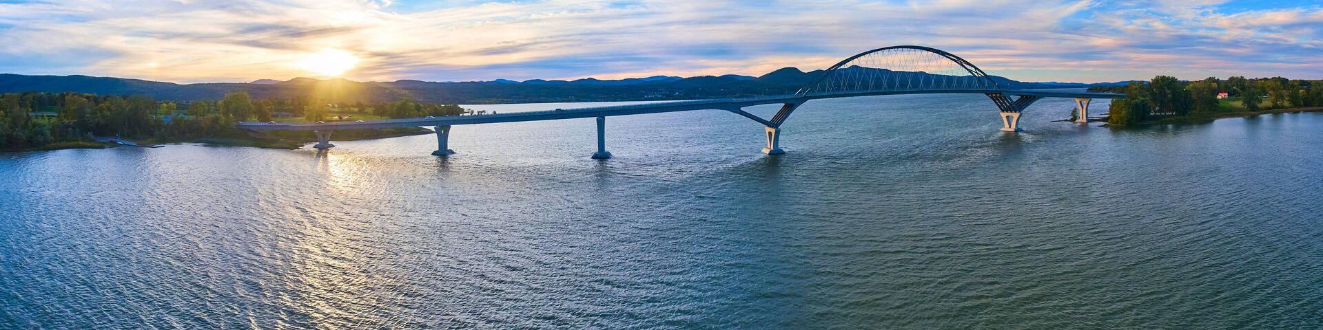 Bridge connecting New York to Vermont panoramic aerial during sunset