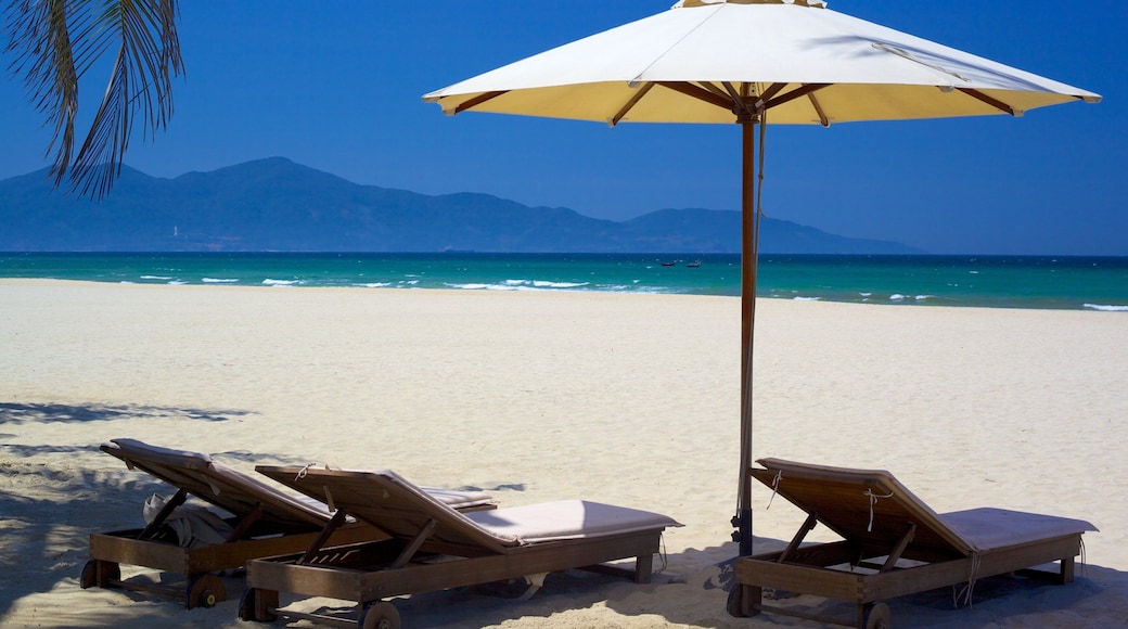 Non Nuoc Beach which includes tropical scenes, a sandy beach and a luxury hotel or resort