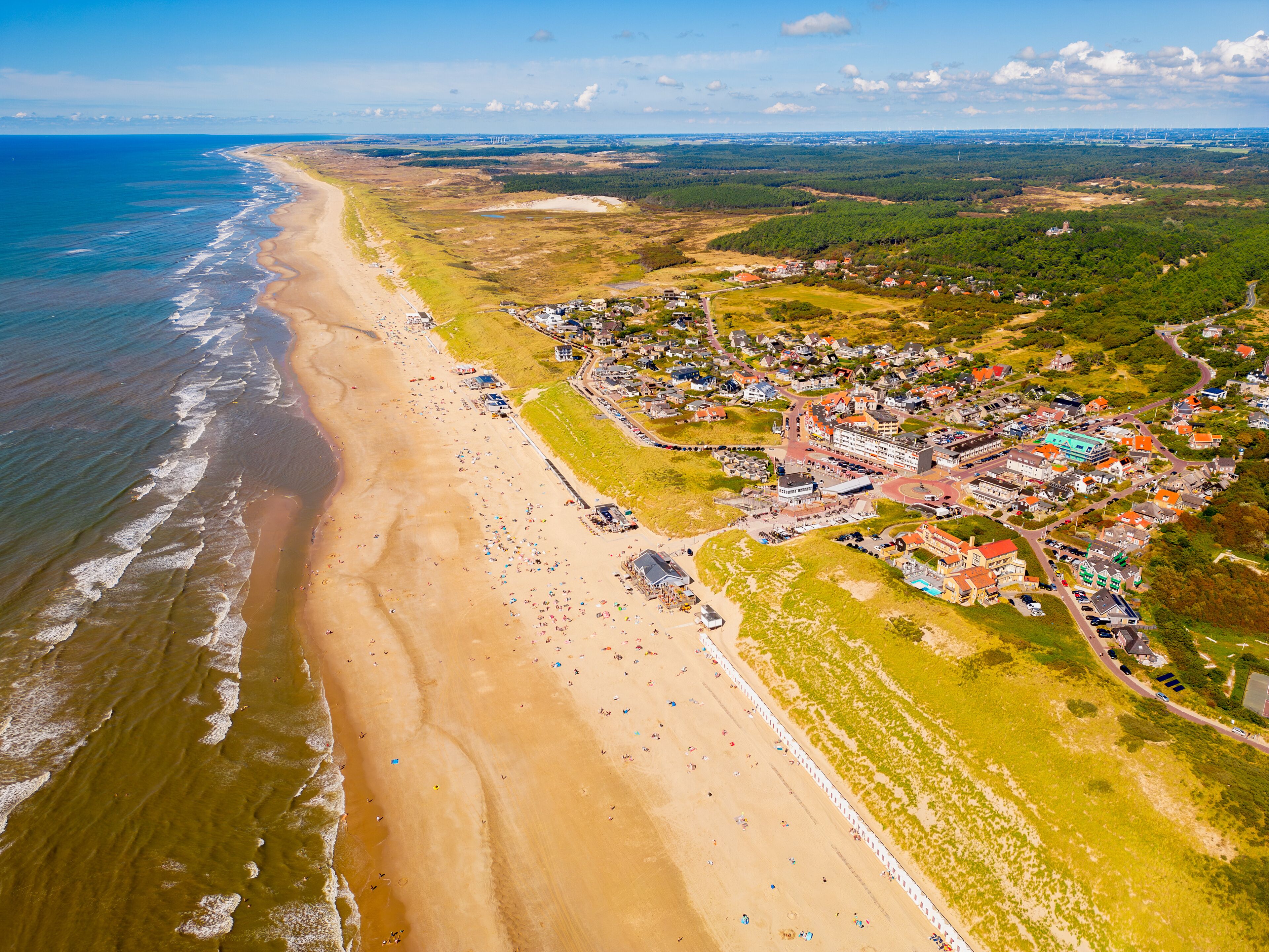 High angle Drone Point of View on Coastal Village of Bergen aan Zee, North-Holland, The Netherlands on summer day