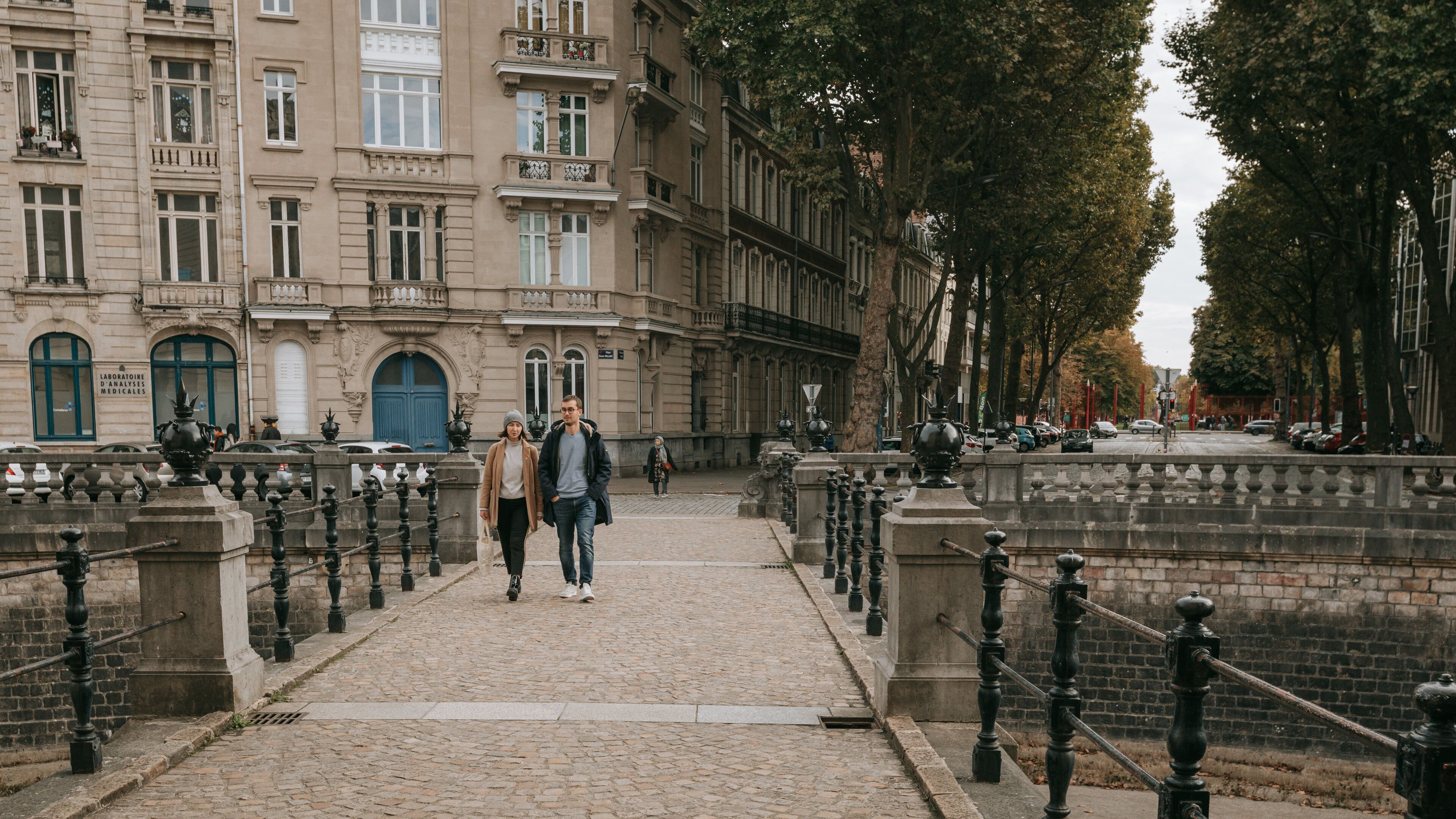 Porte de Paris featuring heritage elements and street scenes as well as a couple