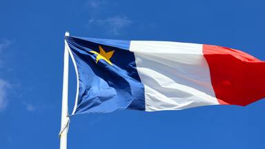 The flag of Acadia was adopted on 15 August 1884, at the Second Acadian National Convention held in Miscouche, Prince Edward Island, by nearly 5,000 Acadian delegates from across the Maritimes.