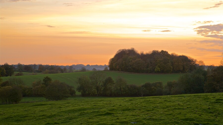 Broughton Castle featuring landscape views, tranquil scenes and a sunset