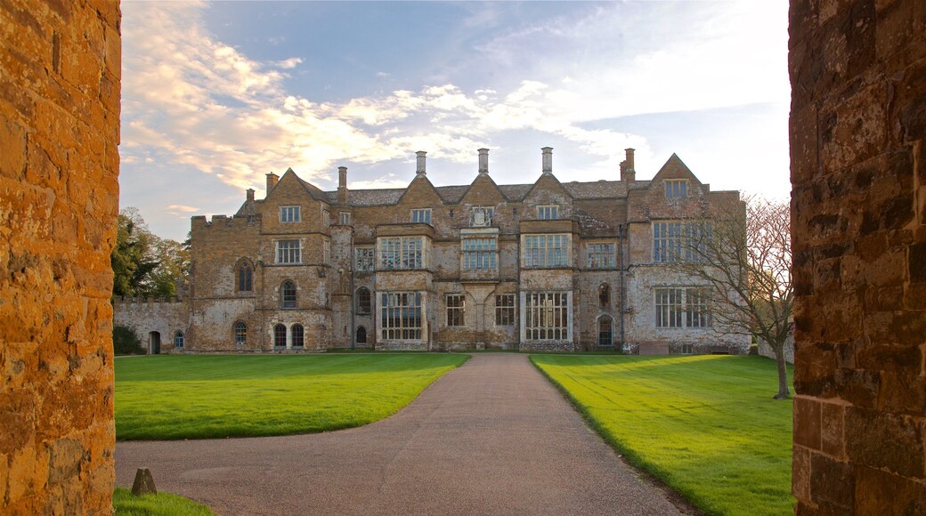 Broughton Castle featuring heritage architecture and a sunset
