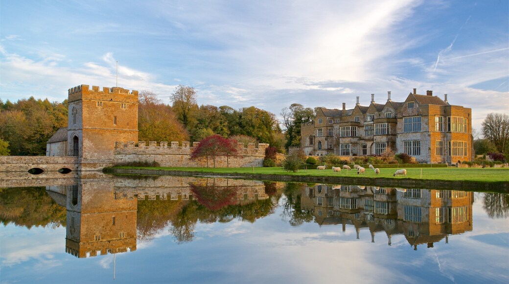 Broughton Castle featuring heritage architecture, chateau or palace and a lake or waterhole