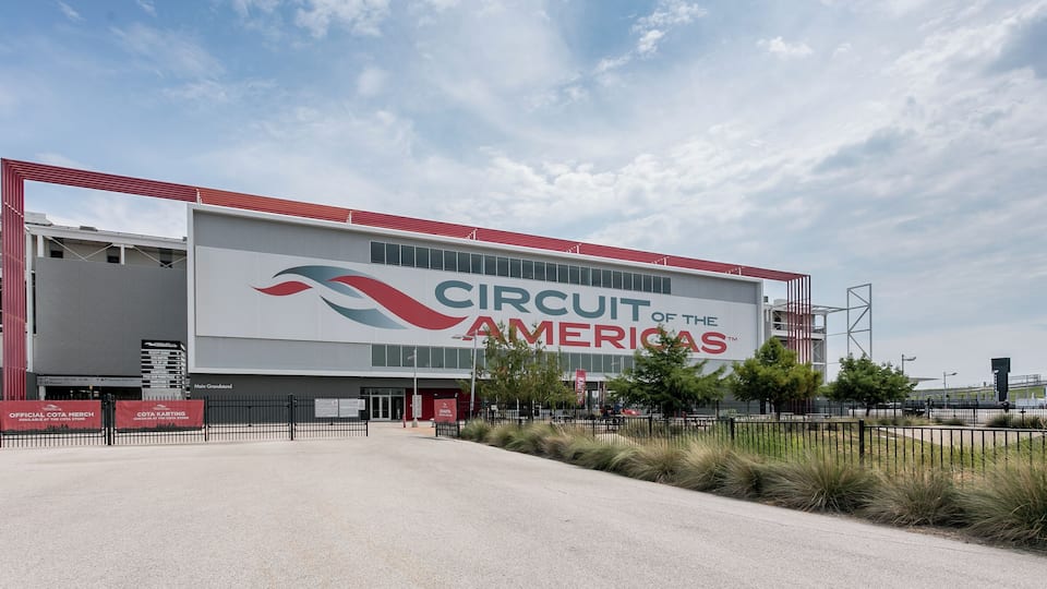 A large building with the sign "Circuit of the Americas".