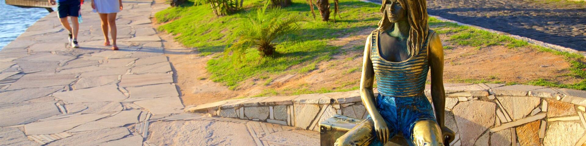 Brigitte Bardot Statue which includes a statue or sculpture and outdoor art as well as a couple