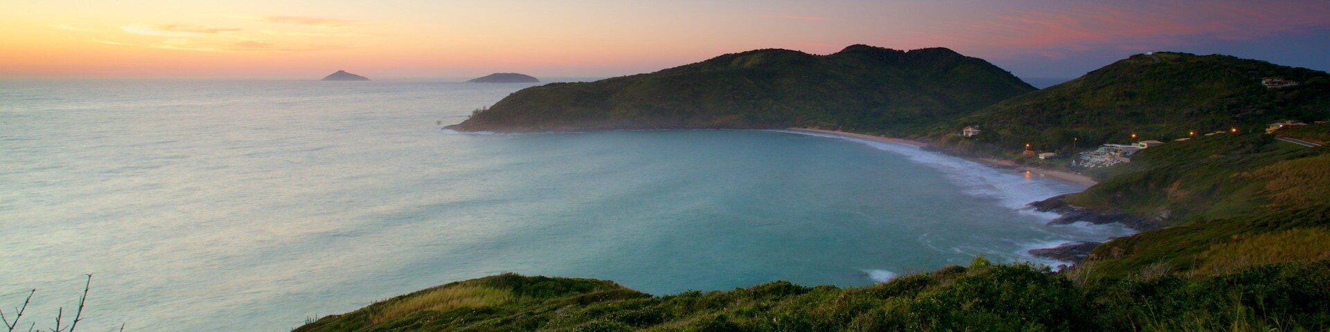 Mirador Joao Fernandes que incluye vista panorámica, vista general a la costa y un atardecer