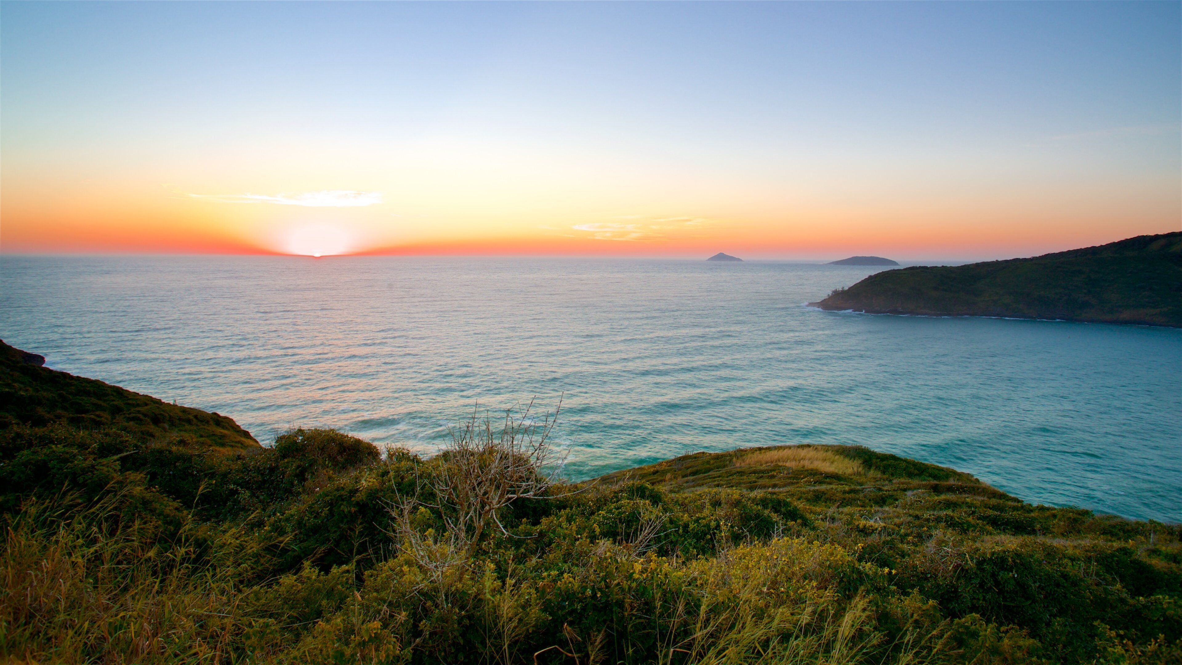 Joao Fernandes Viewpoint which includes landscape views, general coastal views and a sunset