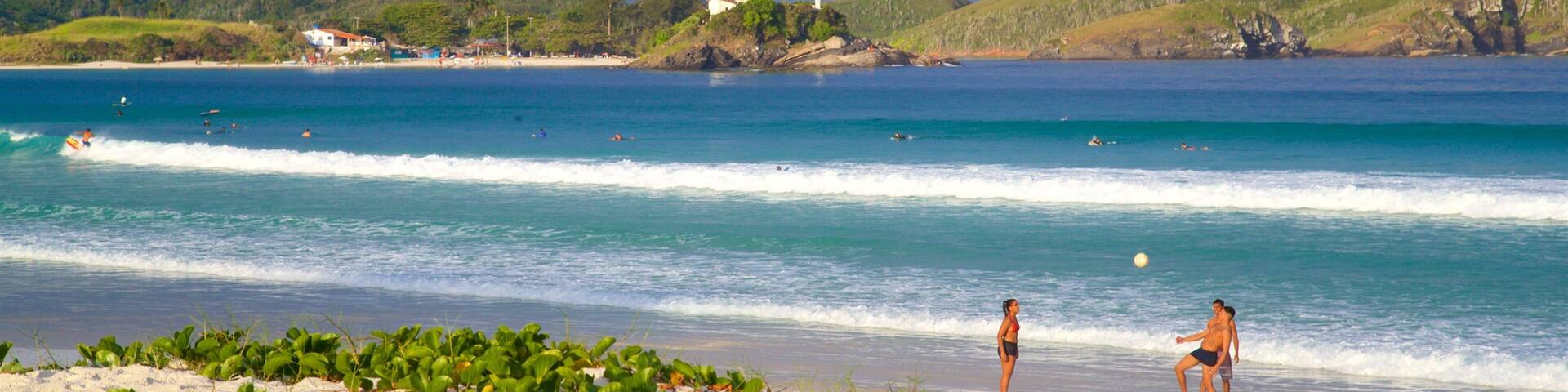 Forte Beach which includes a beach and general coastal views as well as a small group of people