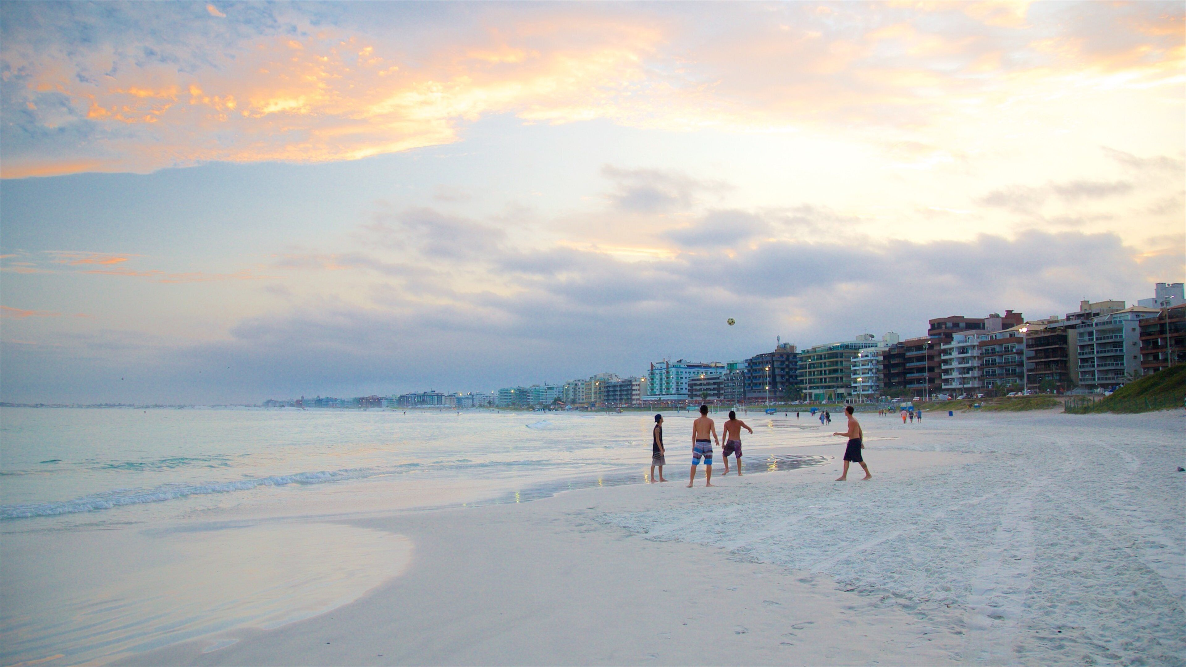 Forte Beach showing a coastal town, a beach and a sunset