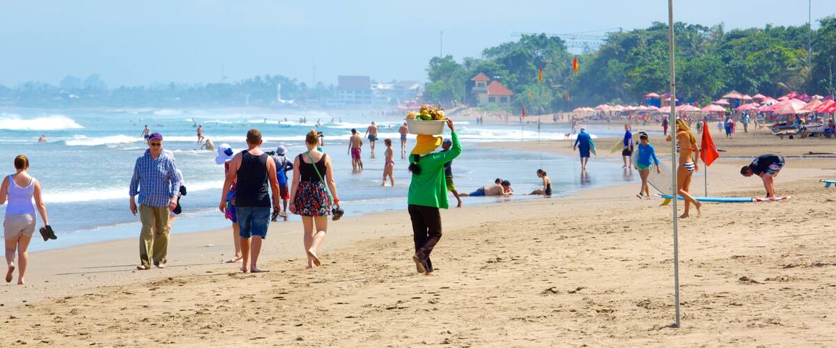Double Six Beach featuring a beach as well as a large group of people