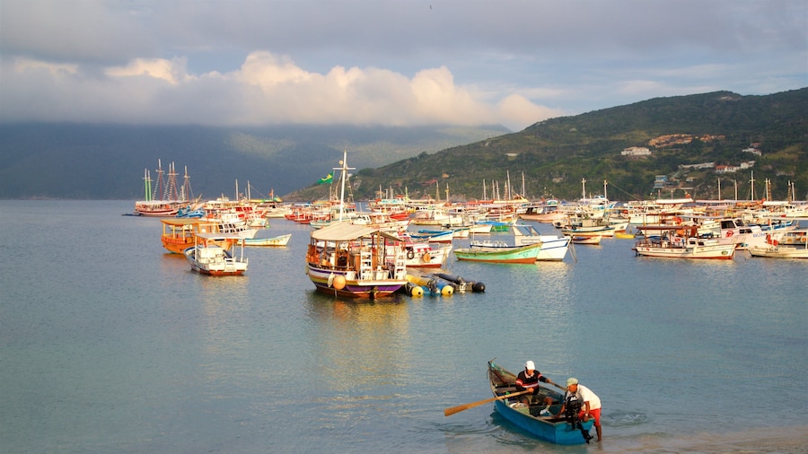 Forno Port showing boating and a bay or harbor as well as a small group of people