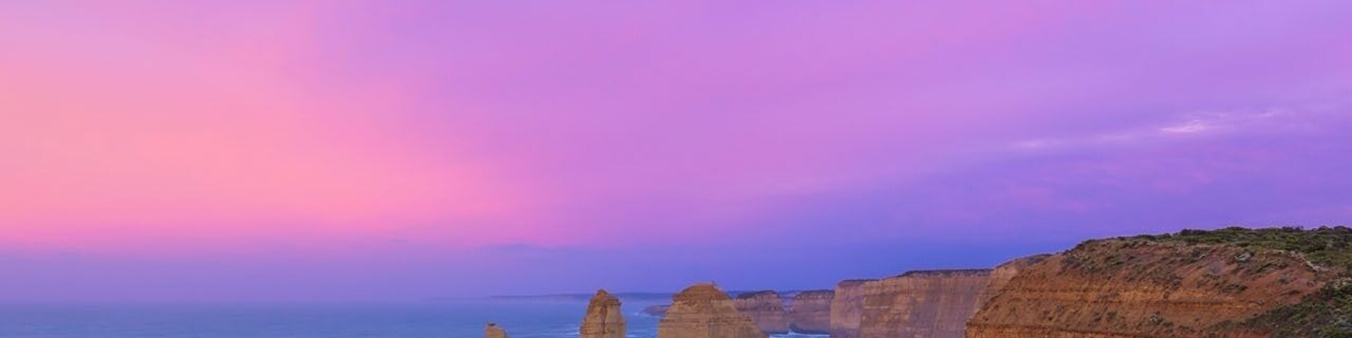 This beautiful sight is only a short drive from Port Campbell by the Great Ocean Road in Victoria. These limestone stacks stand up to 50 metres high and are a spectacular sight to see especially during sunrise or sunsets. Although this formation is called the Twelve Apostles, technically you’re only going to see eight apostles as four have collapsed from erosion since they were first discovered.
I was lucky to have seen the sunrise here every morning for more than a few days and this morning didn't disappoint, the sunrise was spectacular . This is a reverse sunrise shot which means the sun was rising behind me as I took the photo. Although the sunrises at the Twelve Apostles look pretty amazing from the opposite side of the viewing platform any day of the week it's not often you see amazing colours at sunrise looking in this direction across the coastline.