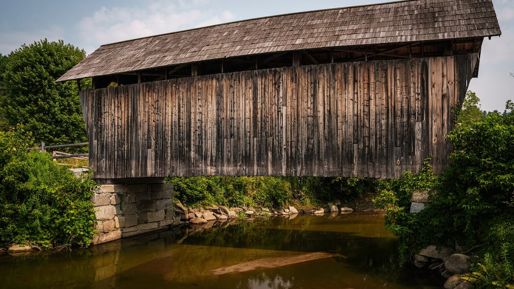 The Martin Covered Bridge, a landmark agricultural bridge built in 1890, spans the Winooski River just off U.S. Route 2 in southern Marshfield, Vermont.