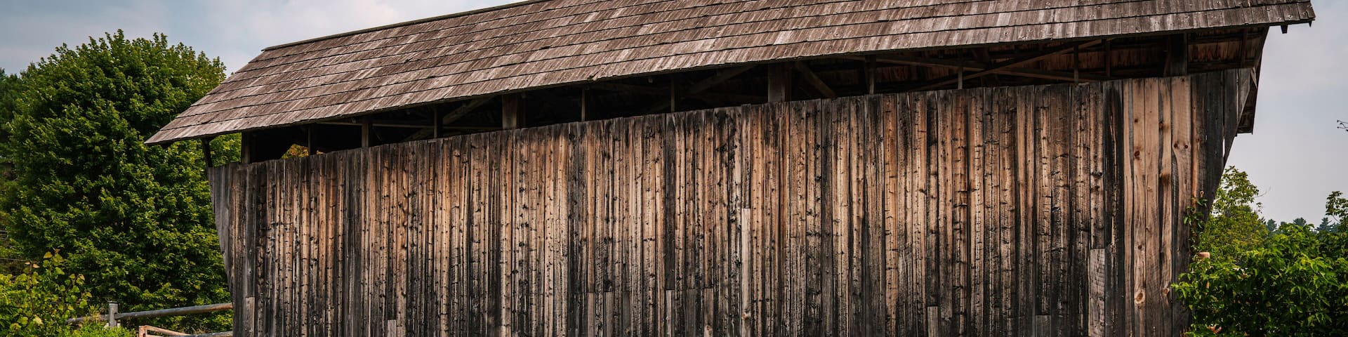 The Martin Covered Bridge, a landmark agricultural bridge built in 1890, spans the Winooski River just off U.S. Route 2 in southern Marshfield, Vermont.