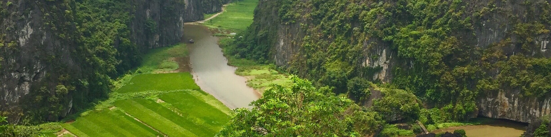 Tam Coc, is a 30-minute bike ride from nearby Ninh Binh. This is the viewpoint from Mua Caves. Ask for directions for the Mua Cave Ecolodge Resort if you need help finding it. Absolutely stunning! Tam Coc can be done as a day-trip from Hanoi or it is a good stopping point as you head north/south in Vietnam. Rent a bicycle and explore!