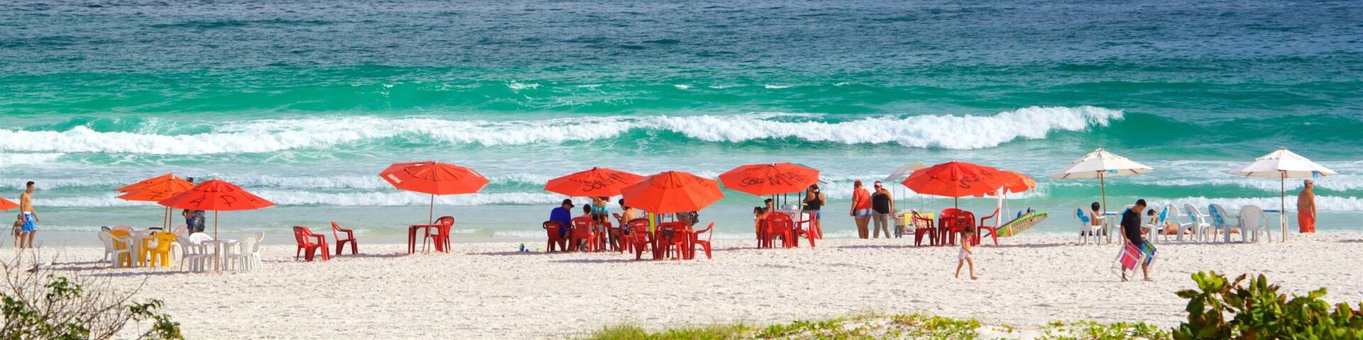 Arraial do Cabo which includes a sandy beach and general coastal views as well as a small group of people
