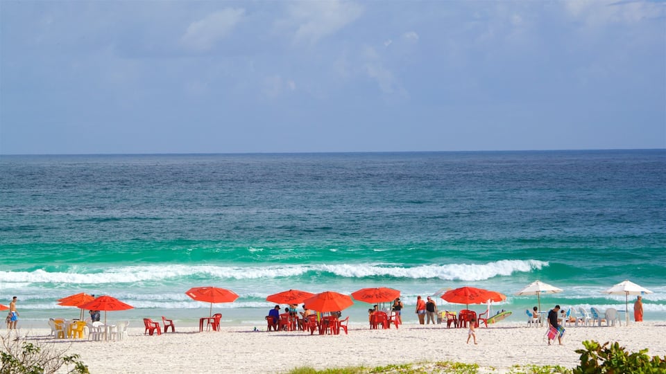 Arraial do Cabo showing a beach and general coastal views as well as a small group of people