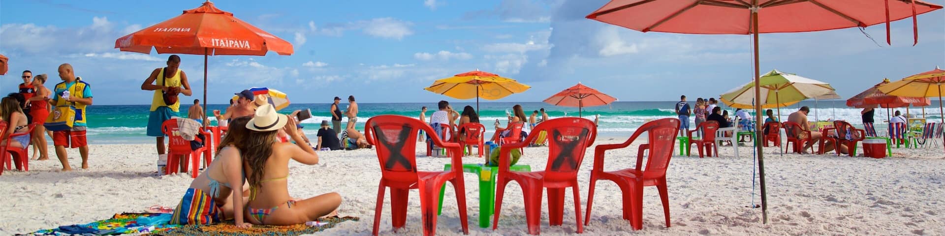 Arraial do Cabo which includes a sandy beach and general coastal views as well as a small group of people