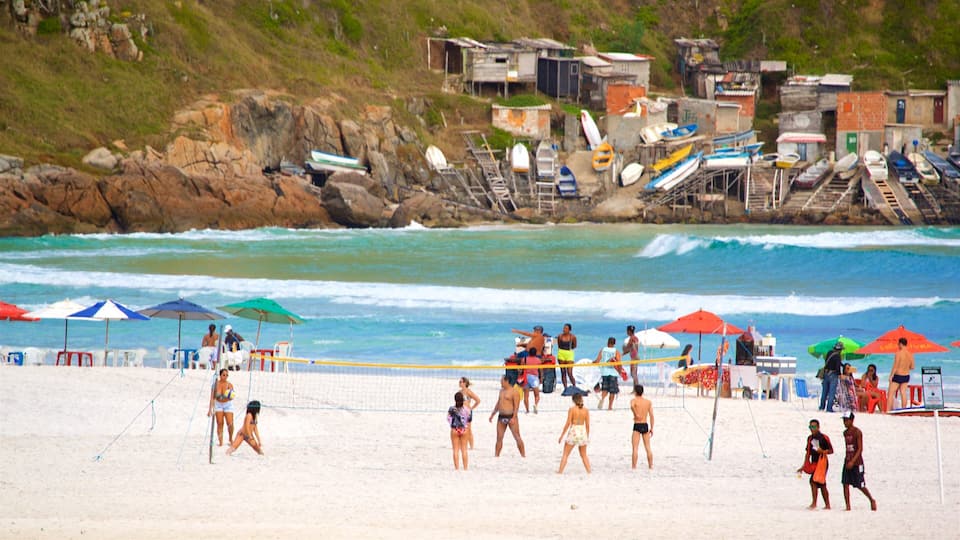 Arraial do Cabo which includes a sandy beach and general coastal views as well as a small group of people
