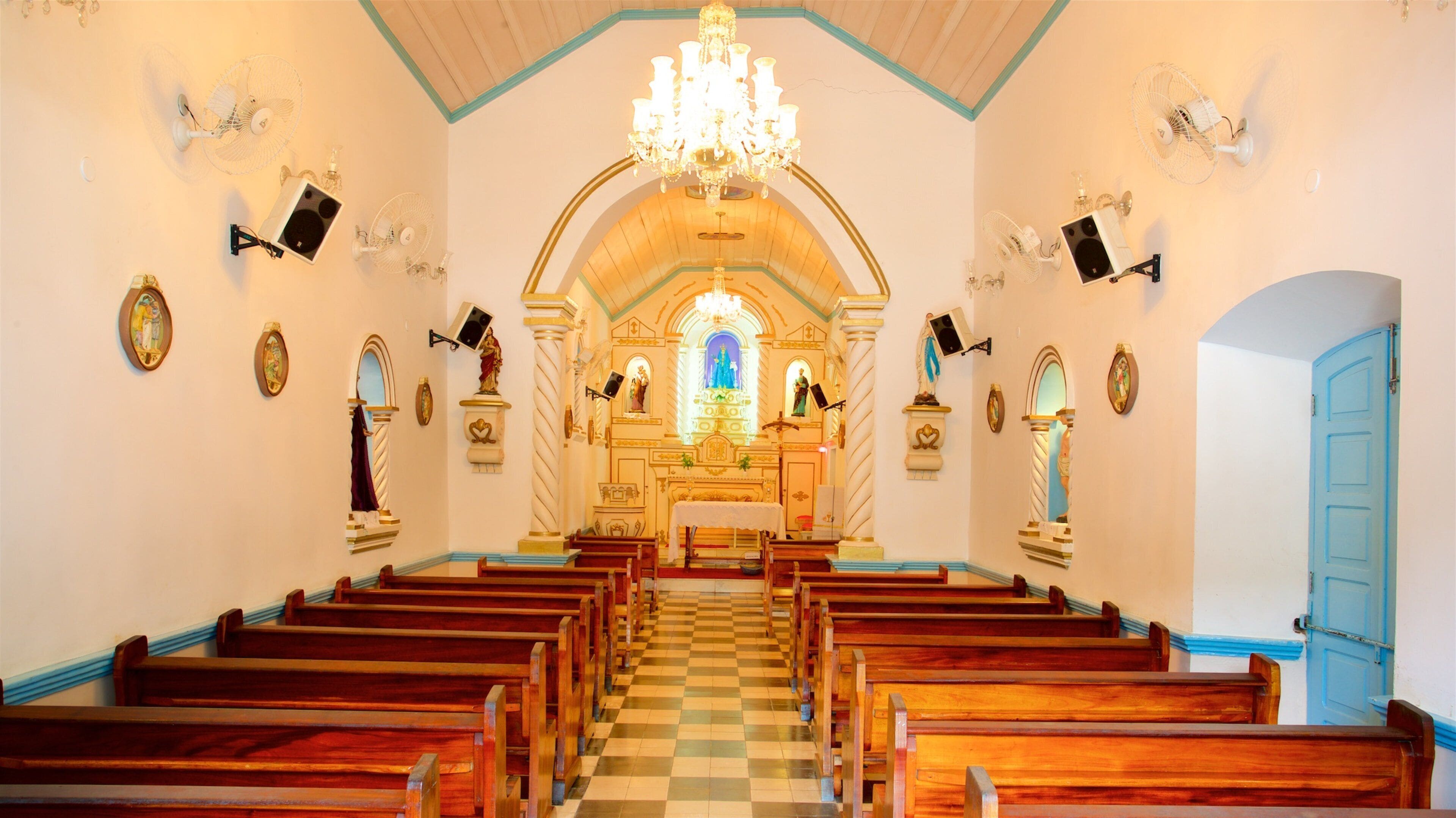 Our Lady of Remedies Church featuring a church or cathedral and interior views