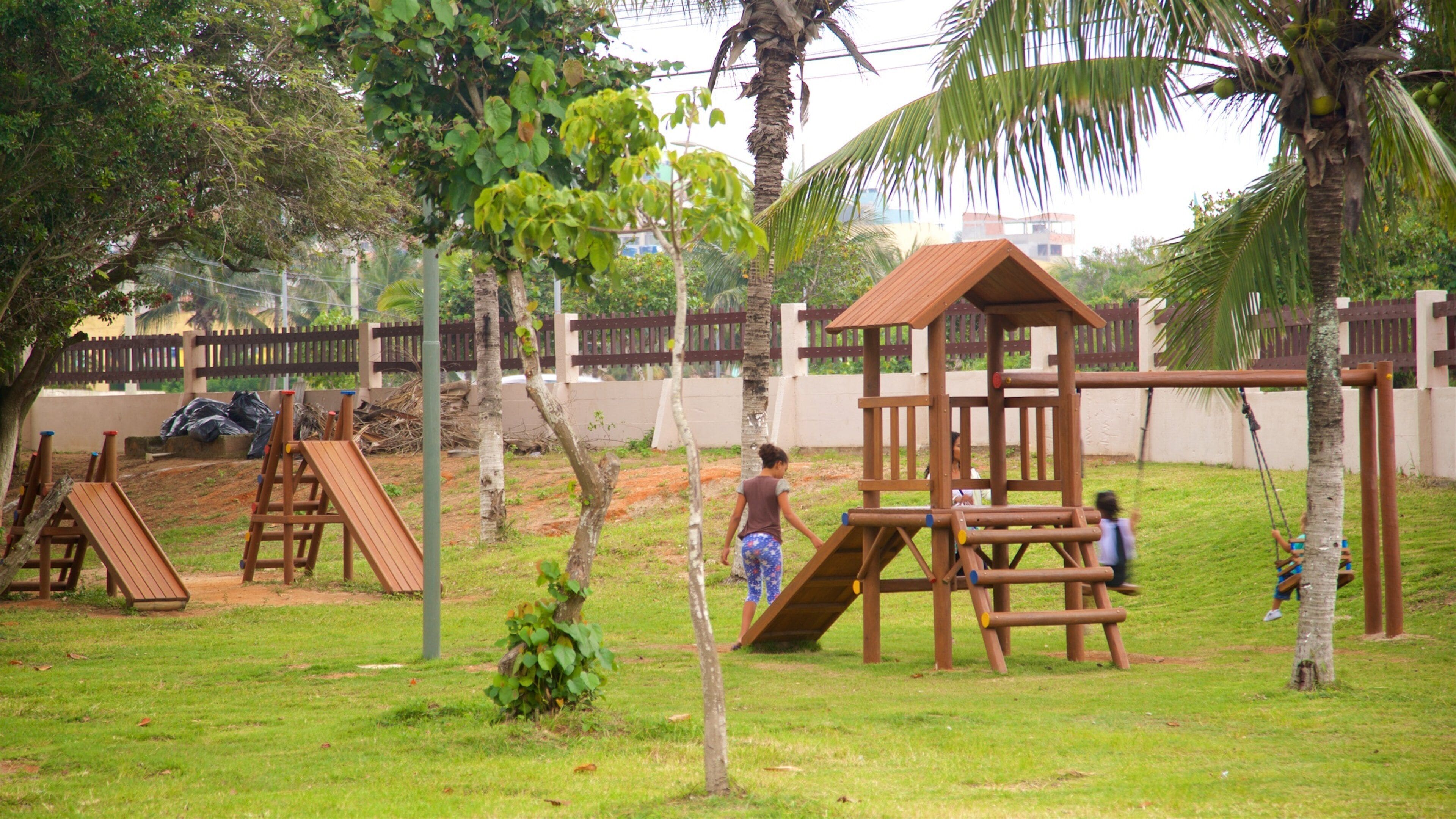 Hermes Barcellos Public Park which includes a park and a playground as well as a family