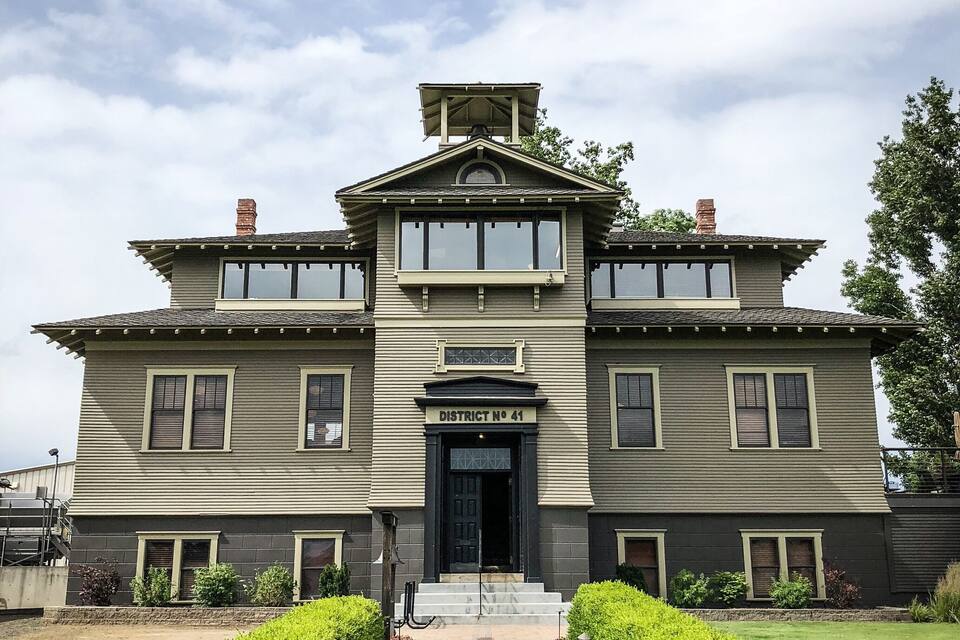 A large, two-story building with a sign reading "District No. 41" at the entrance.
