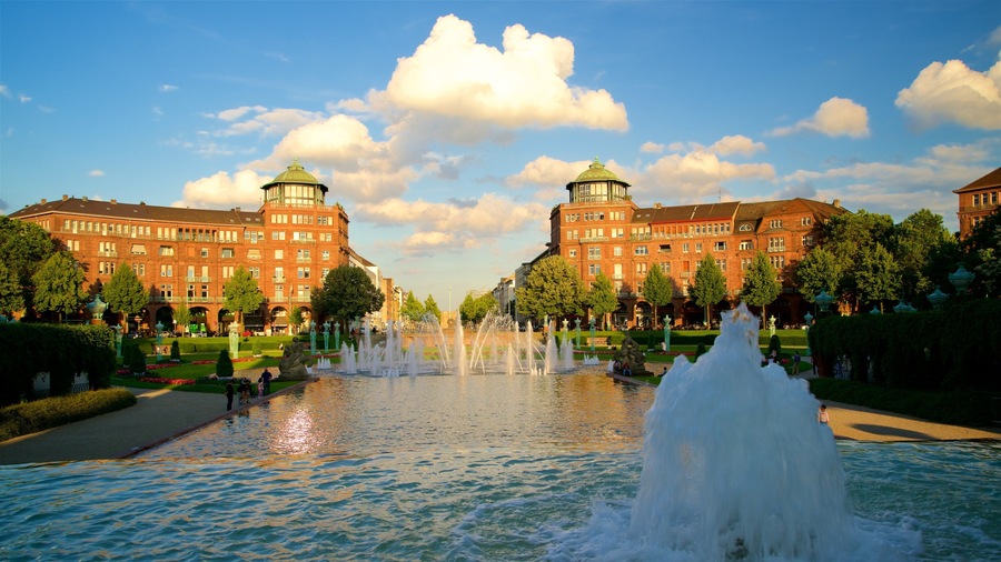 Friedrichsplatz which includes a fountain, a park and a sunset