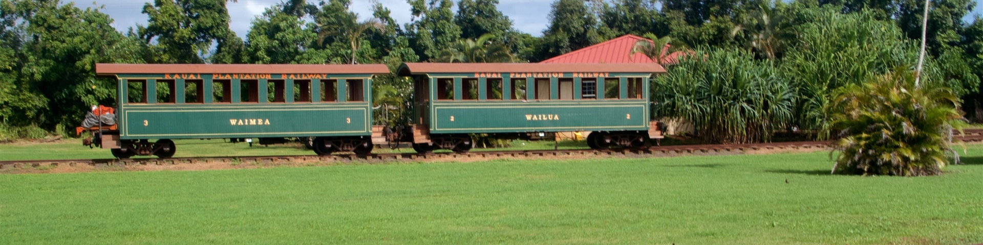 Kilohana Plantation featuring railway items, heritage elements and a garden