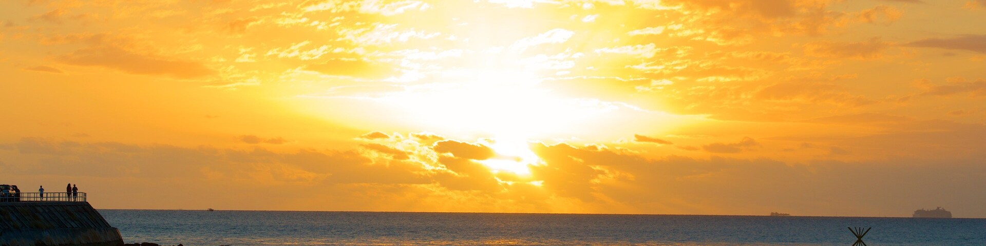 Baie des Citrons featuring a beach and a sunset