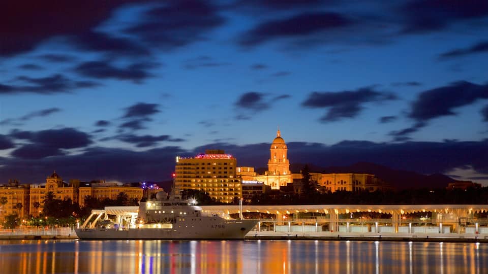 Port of Malaga which includes boating, a city and night scenes