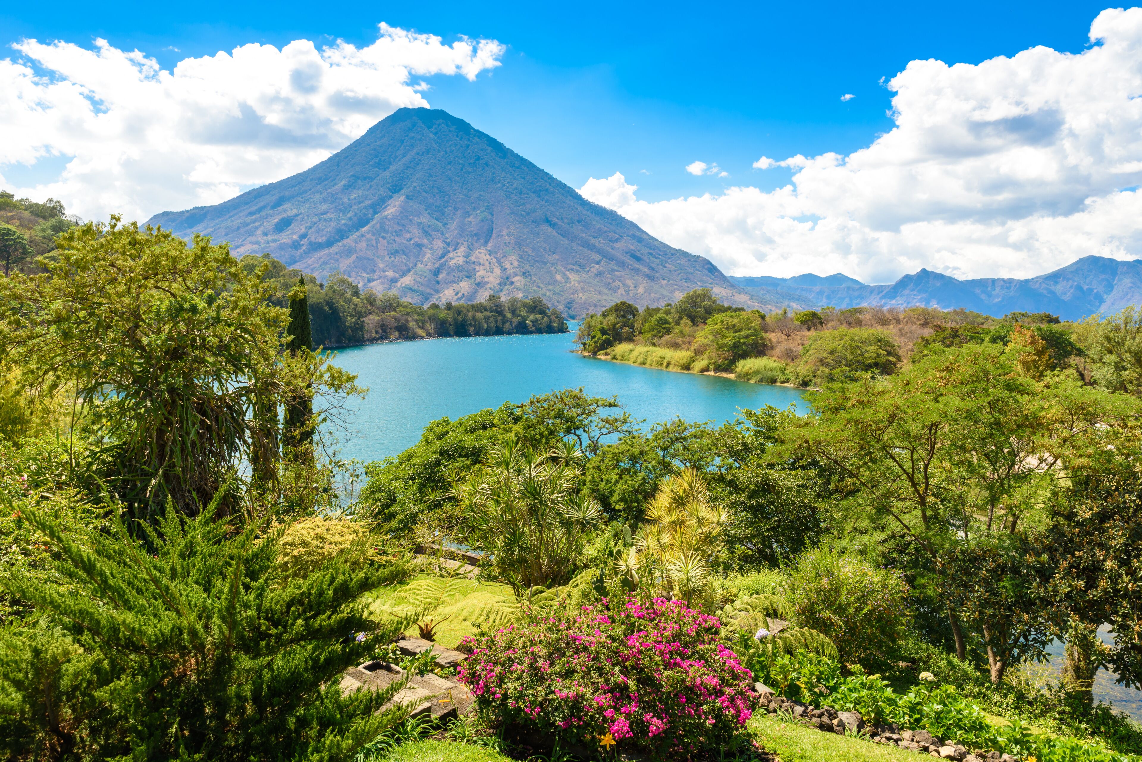 Beautiful bay of Lake Atitlan with view to Volcano San Pedro  in highlands of Guatemala, Central America