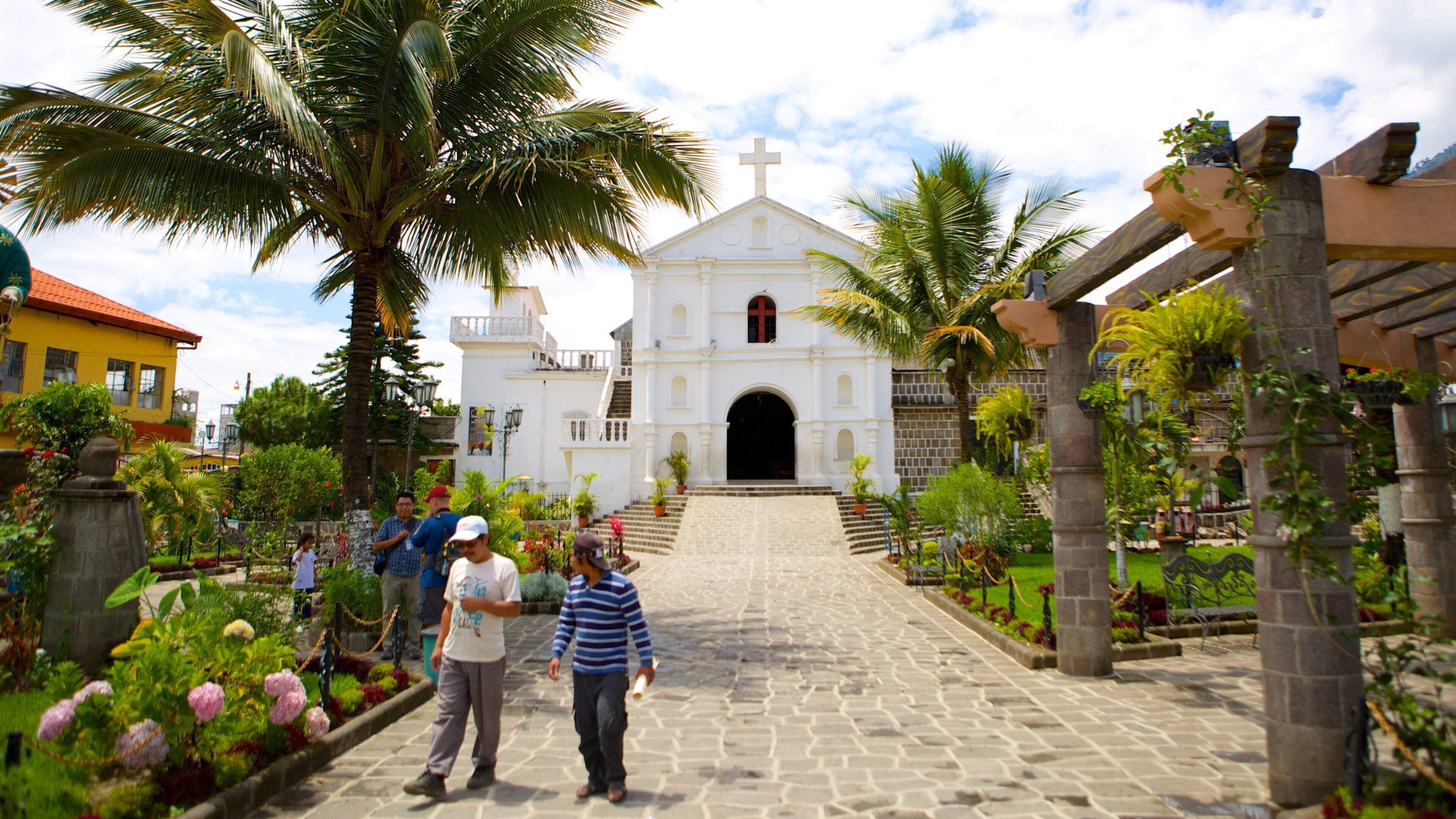 Church of Saint Peter featuring a park and a church or cathedral as well as a small group of people