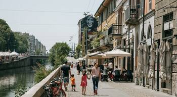 Porta Genova featuring street scenes and a city as well as a family