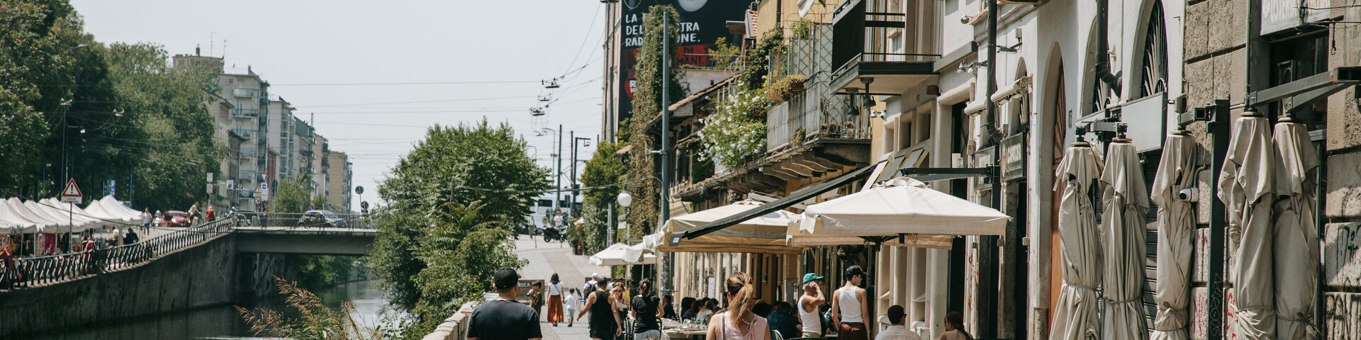Porta Genova featuring street scenes and a city as well as a family