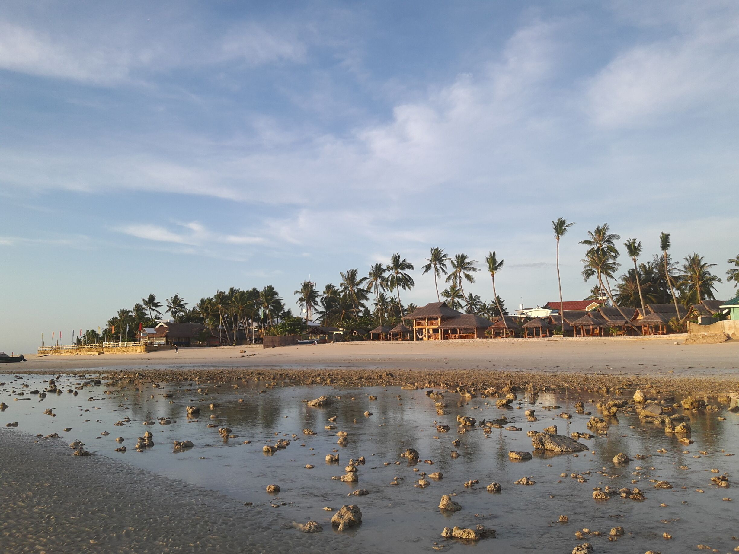 the view of the white sand beach front of sta. fe 