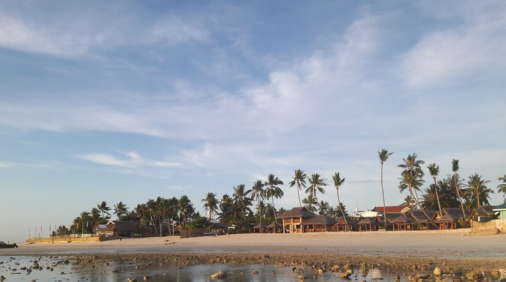 the view of the white sand beach front of sta. fe