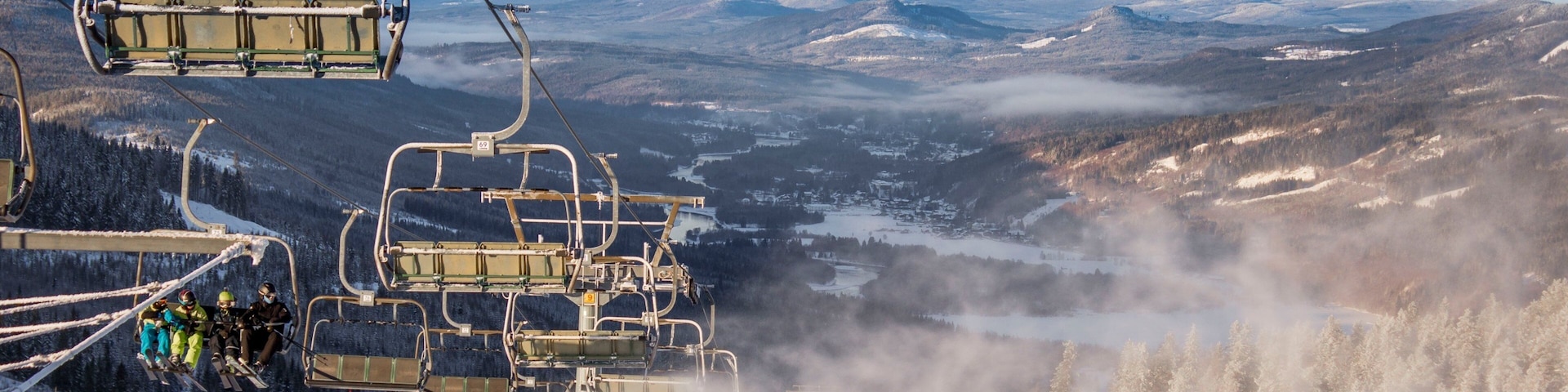 Branas Ski Resort featuring a gondola, mist or fog and snow