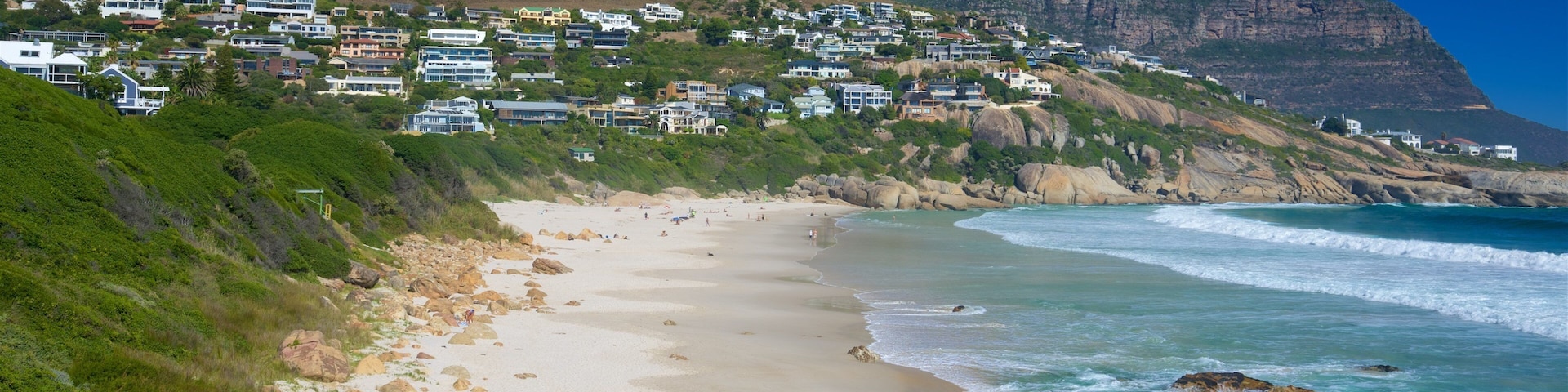 Llandudno Beach showing a sandy beach and rocky coastline