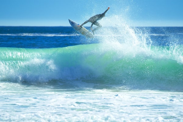 Llandudno Beach featuring surfing and waves