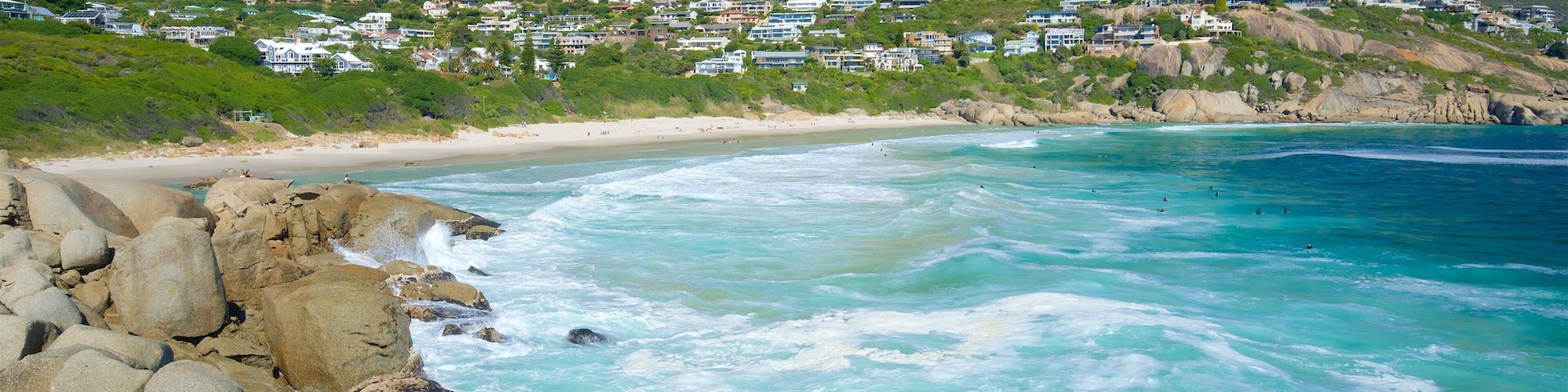 Llandudno Beach which includes surf, a beach and rugged coastline