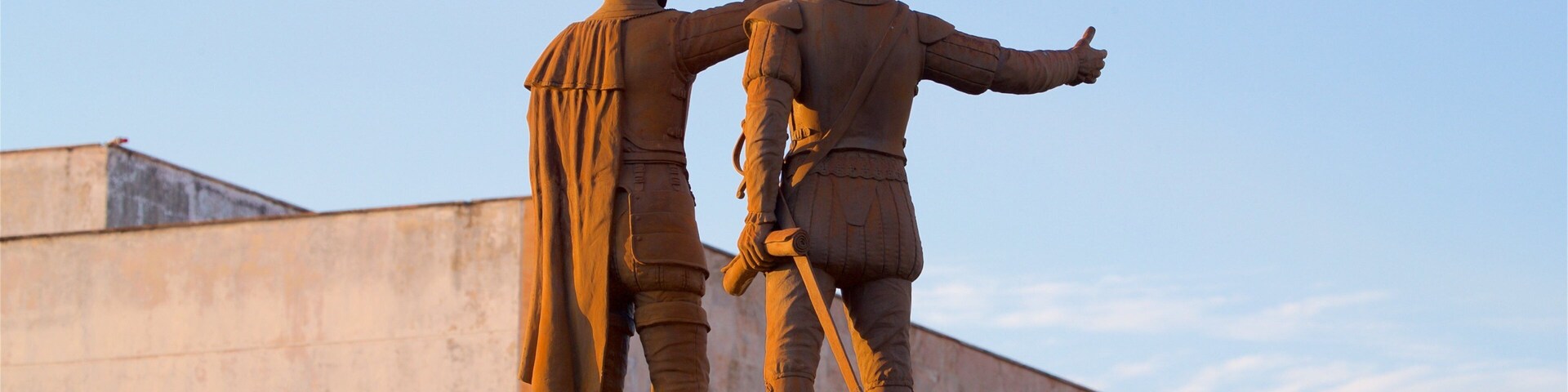 Paseo de Montejo featuring a sunset and a statue or sculpture
