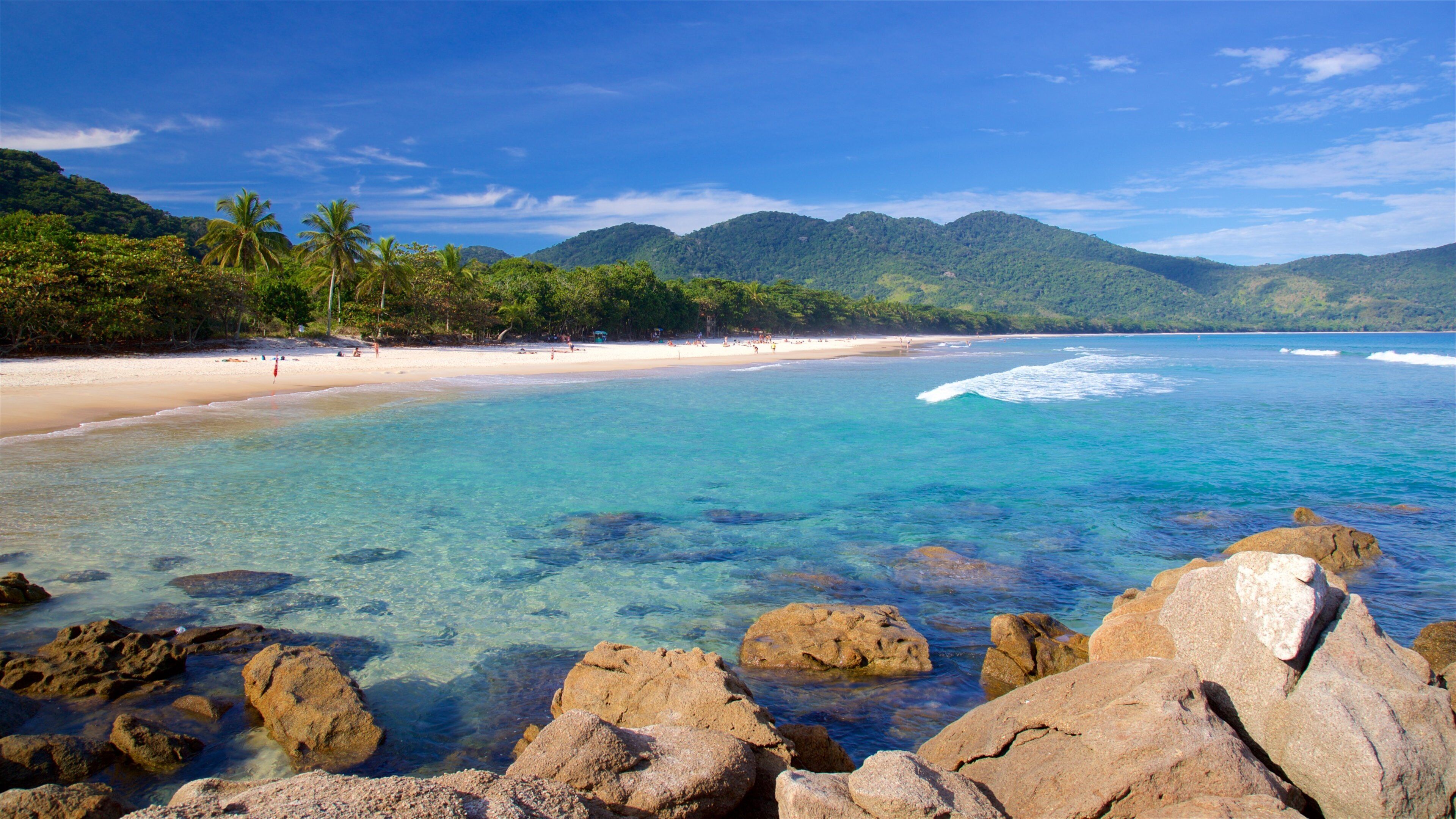 Lopes Mendes Beach featuring a beach, rocky coastline and tropical scenes