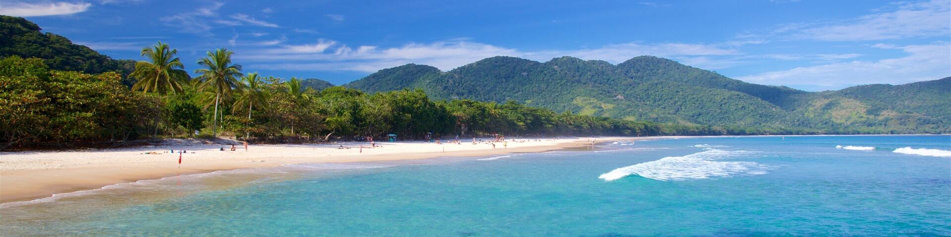 Lopes Mendes Beach featuring a beach, rocky coastline and tropical scenes