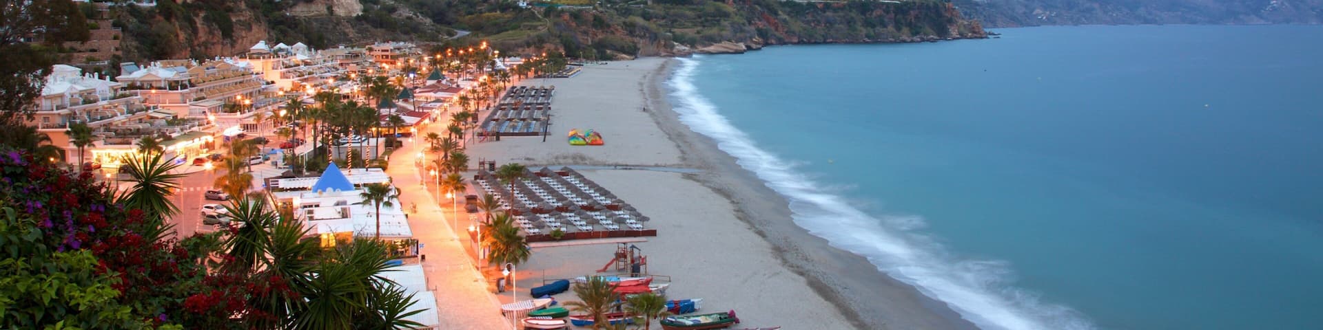 Playa de Burriana mettant en vedette ville côtière, baie ou port et scènes de nuit