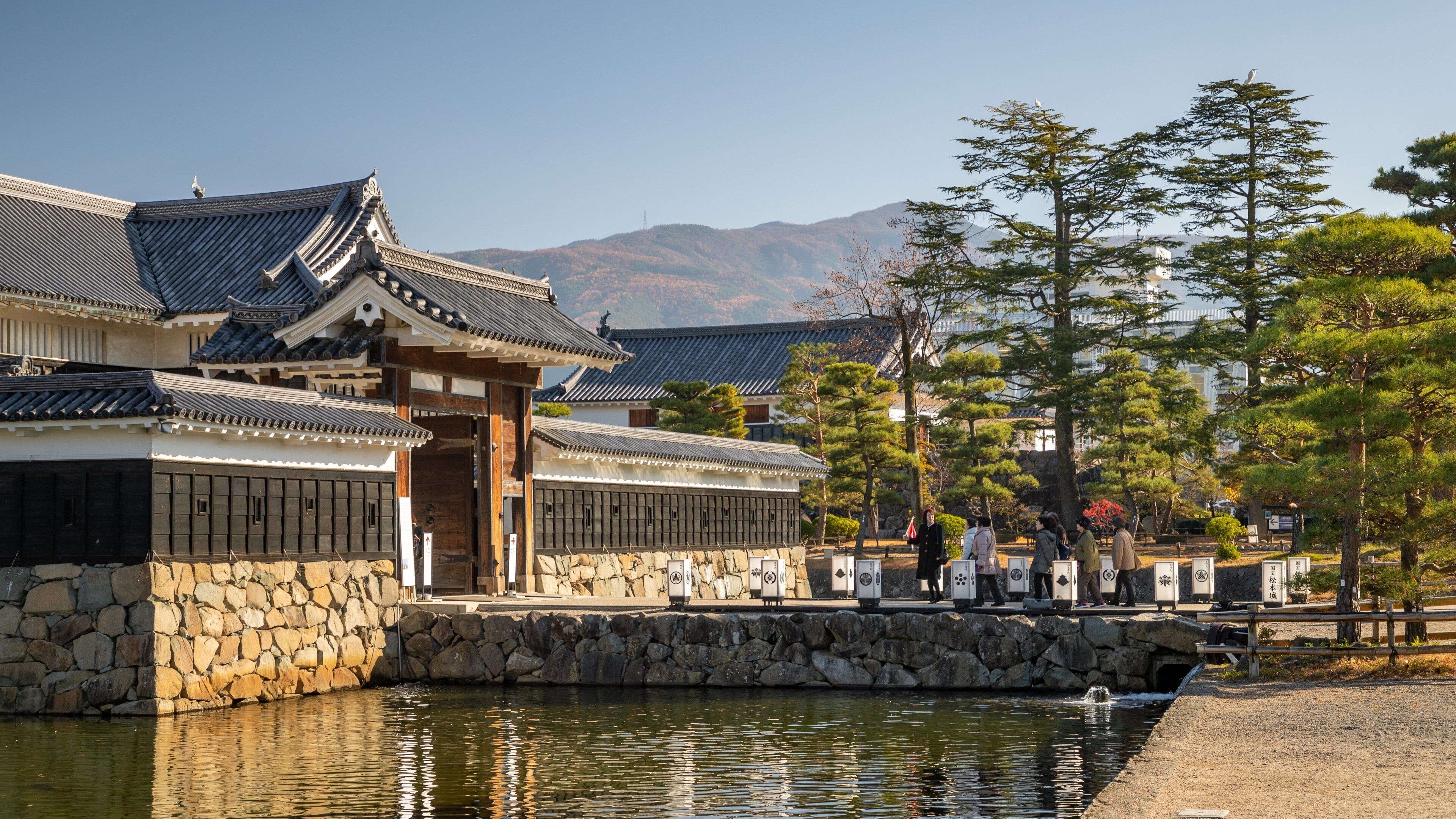 Matsumoto Castle showing a pond and heritage elements