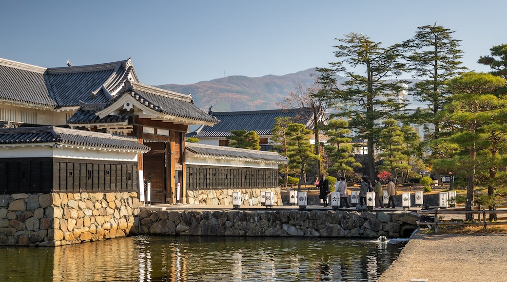 Matsumoto Castle showing a pond and heritage elements