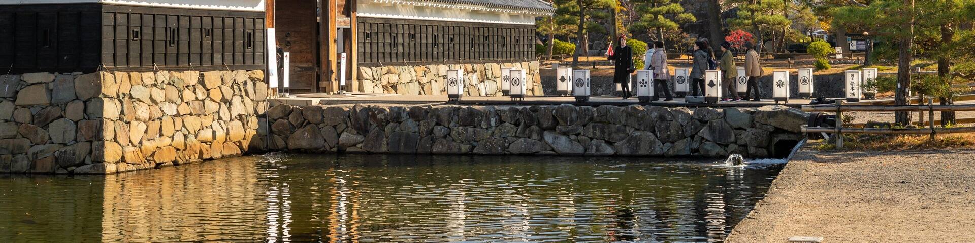 Matsumoto Castle showing a pond and heritage elements