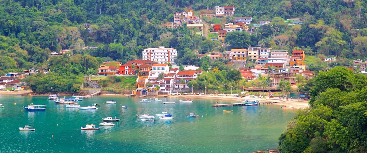 Camorim Beach showing general coastal views, a coastal town and a bay or harbour