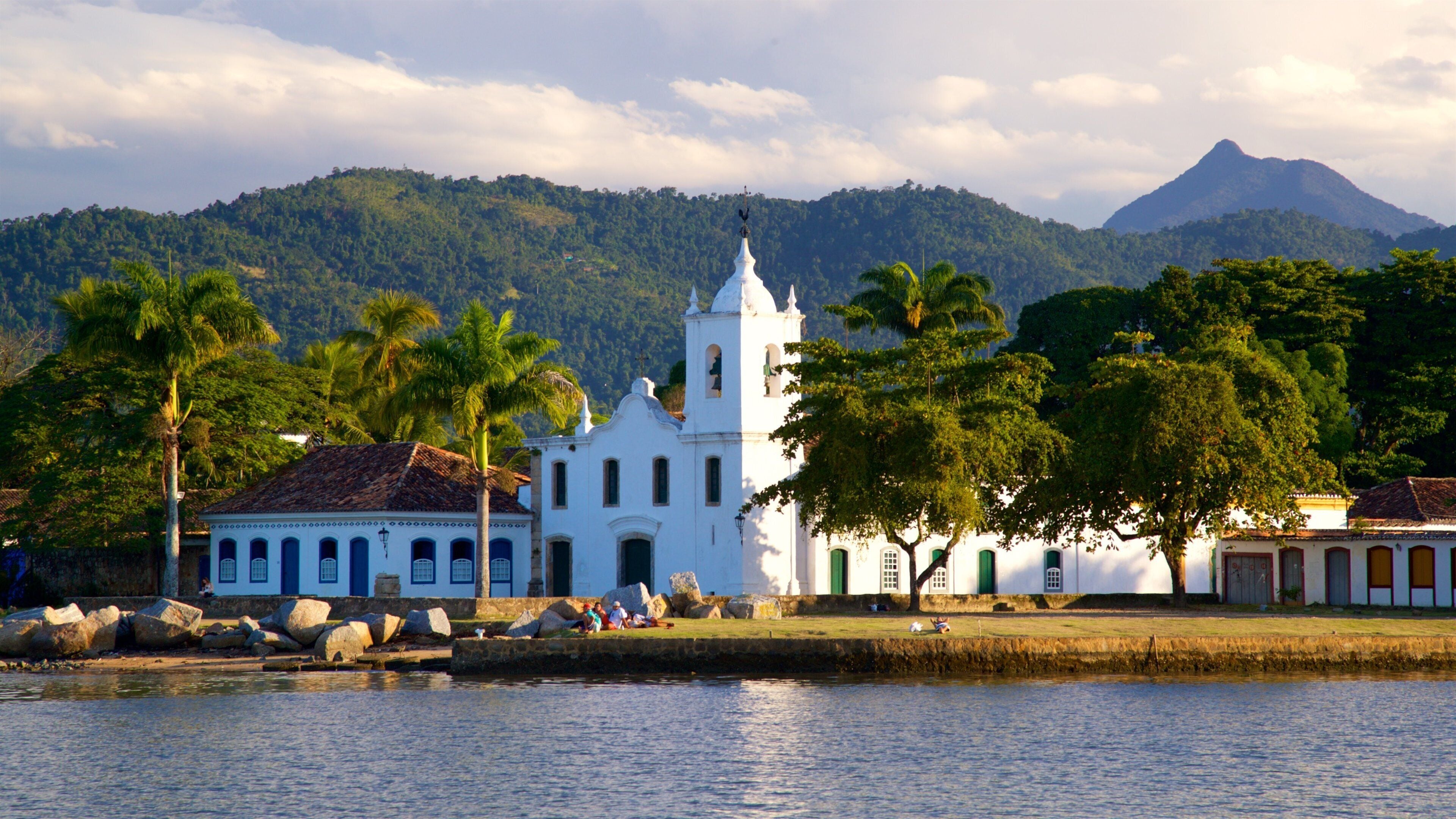 Nossa Senhora das Dores Church featuring a lake or waterhole, a church or cathedral and heritage architecture